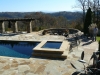 Geometric pool with raised spa, arbor and outdoor firepit